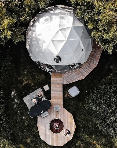 An aerial view of a camping setup with a dome