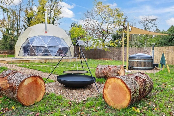 A camping setup with a dome in the background